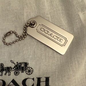 Coach Silver hang tag. Pristine
